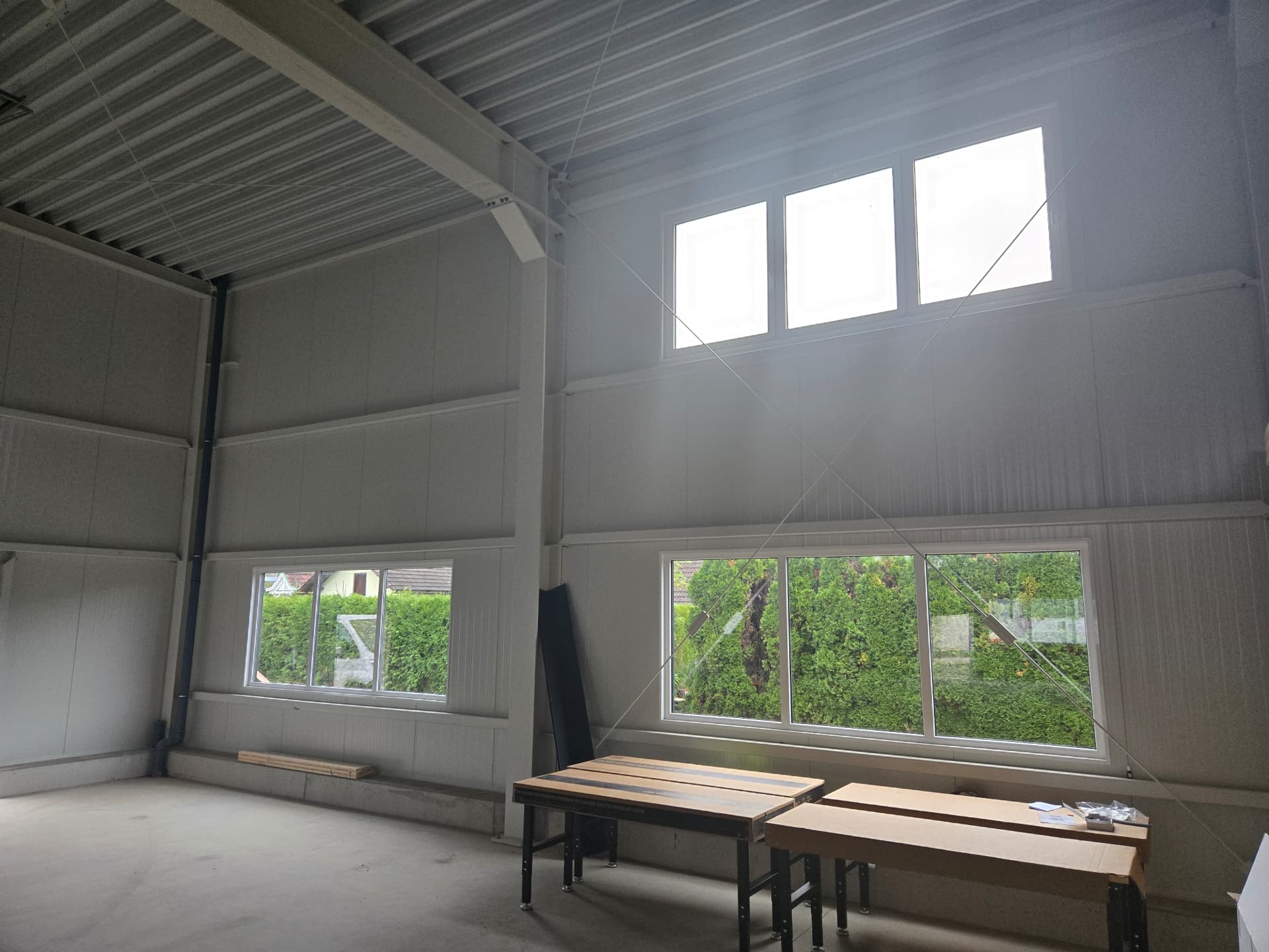 Industrial building with sandwich-panel façade and integrated windows — 3