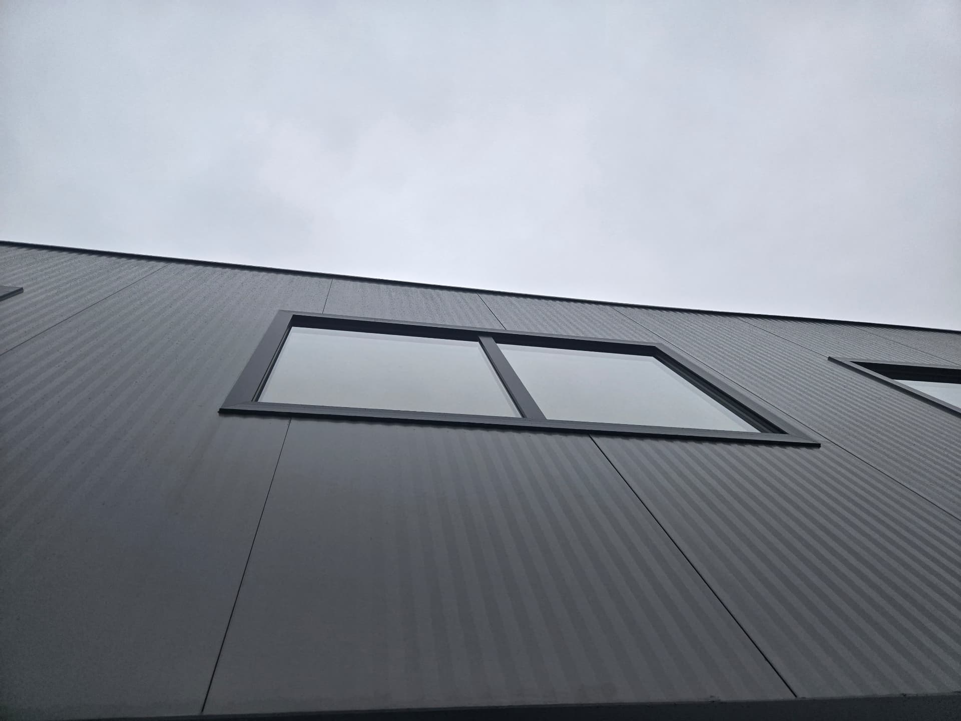 Industrial building with sandwich-panel façade and integrated windows — 6