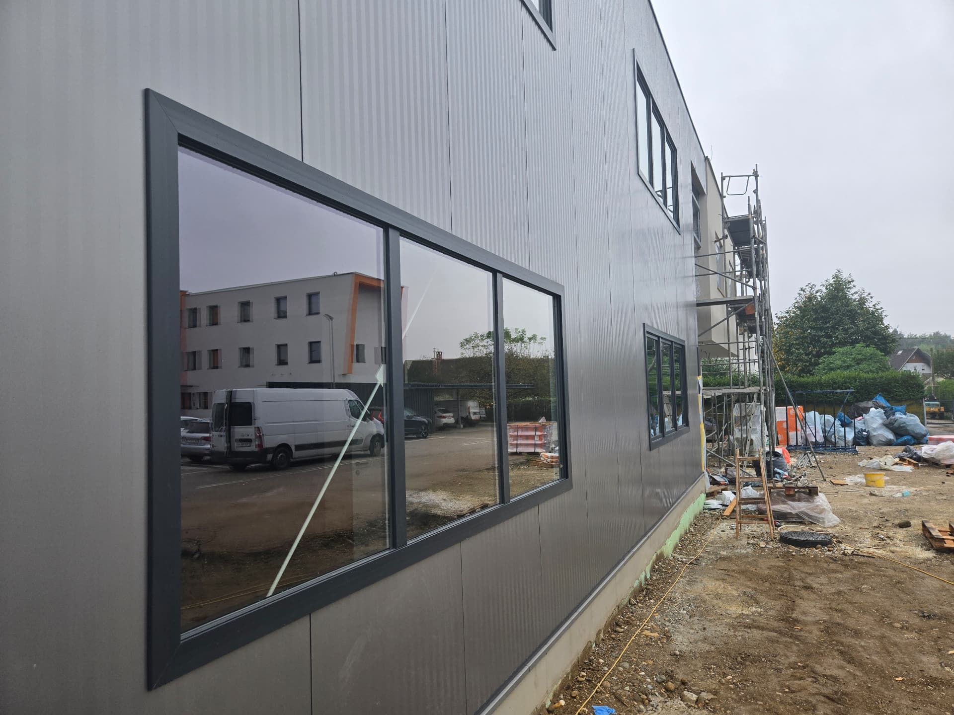 Industrial building with sandwich-panel façade and integrated windows — 7